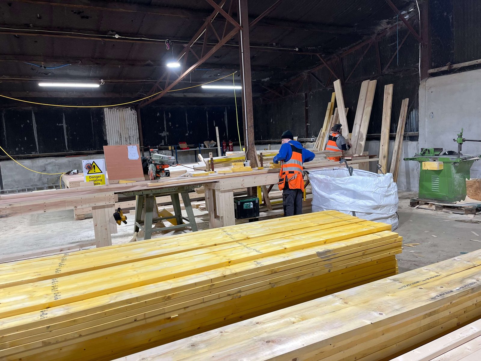 HBC Timberframe team fabricating timber frame components in facility